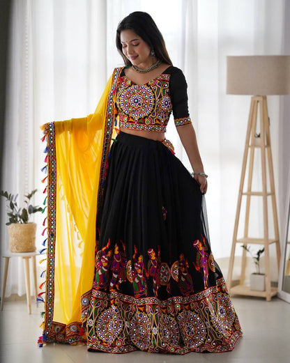 Black Navratri Lehenga Choli Set With Gujarati Embroidery and traditional Garba Dancer Motifs With Yellow Dupatta
