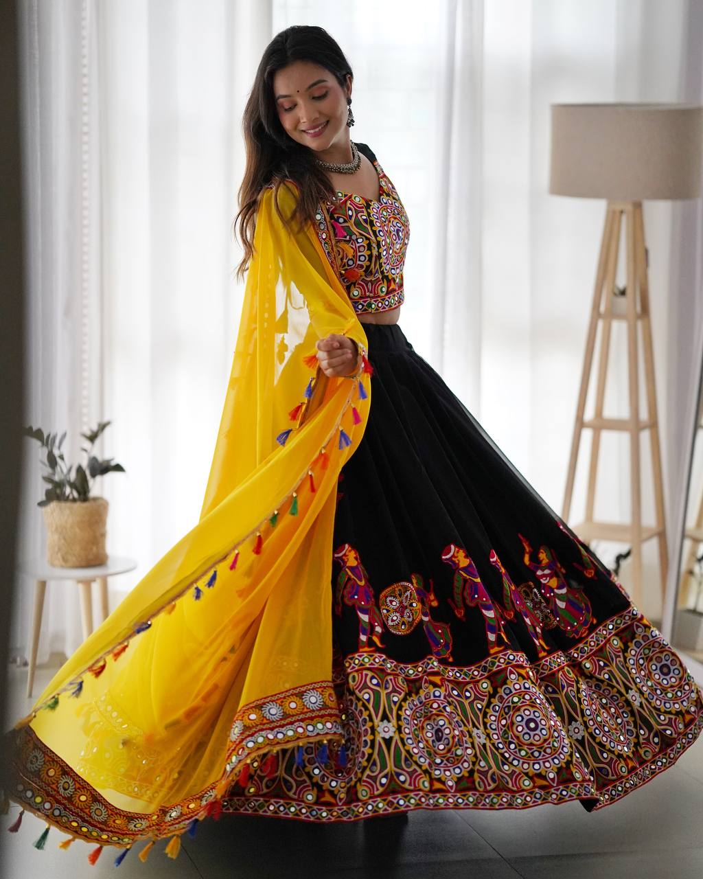 Black Navratri Lehenga Choli Set With Gujarati Embroidery and traditional Garba Dancer Motifs With Yellow Dupatta