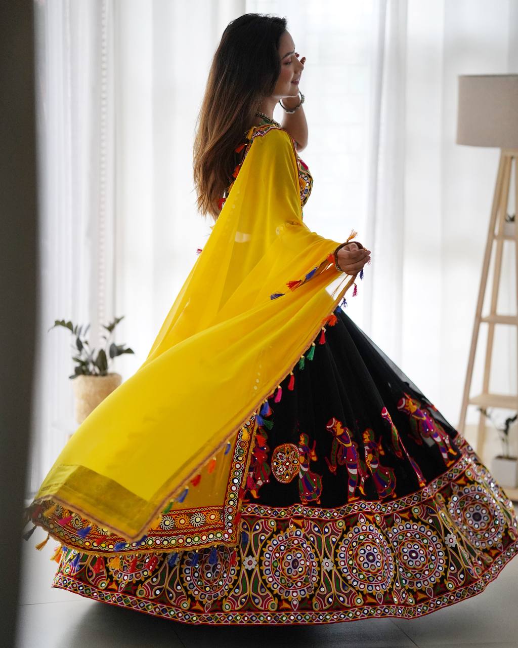 Black Navratri Lehenga Choli Set With Gujarati Embroidery and traditional Garba Dancer Motifs With Yellow Dupatta