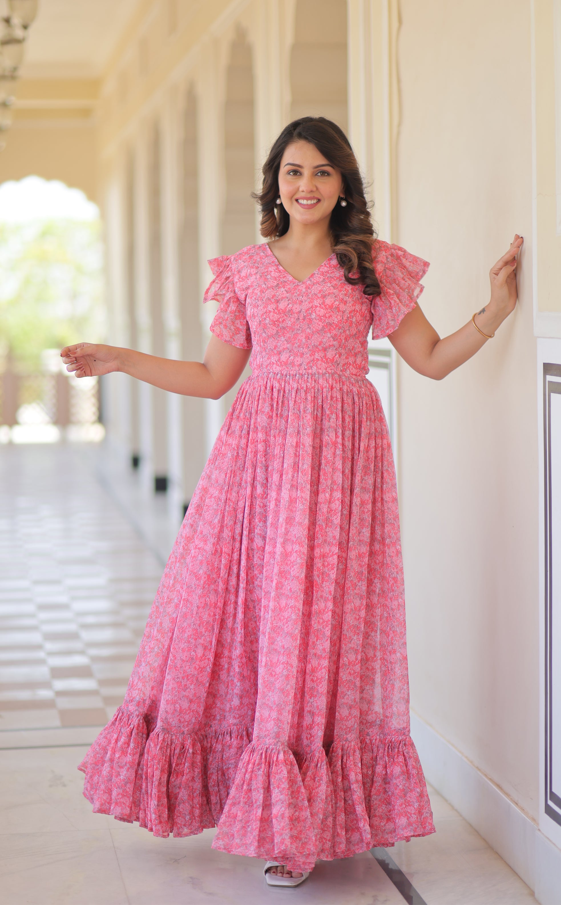 Faux Georgette Printed Pink Gown with Bell Sleeves | 7 Mtr Flair | Fancy V Neck | Full Stitched