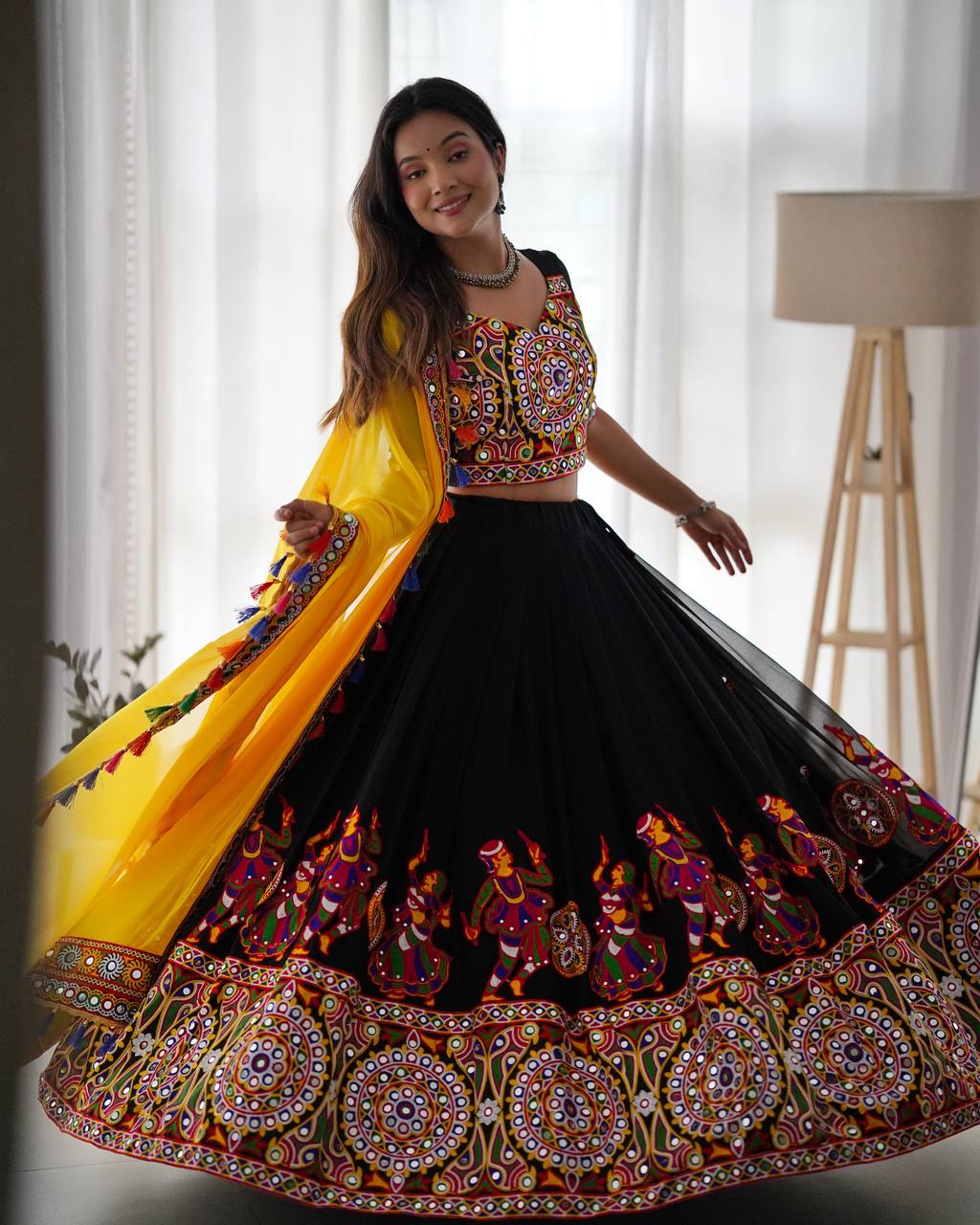 Black Navratri Lehenga Choli Set With Gujarati Embroidery and traditional Garba Dancer Motifs With Yellow Dupatta