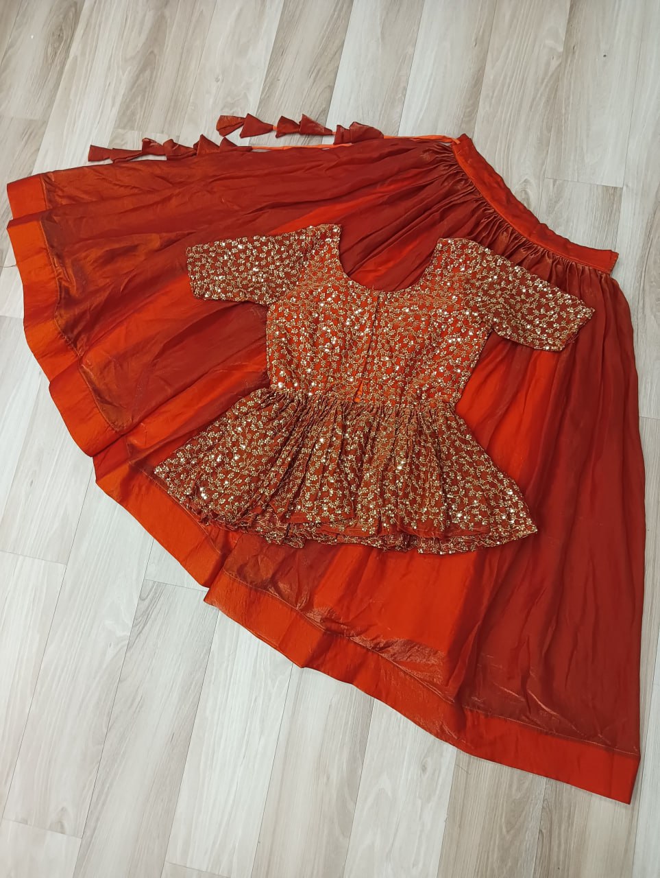 Fendy Fabric Sequins Embroidered Blouse with Plain Flared Orange Lehenga – Elegant Partywear Set (Full-Stitched)