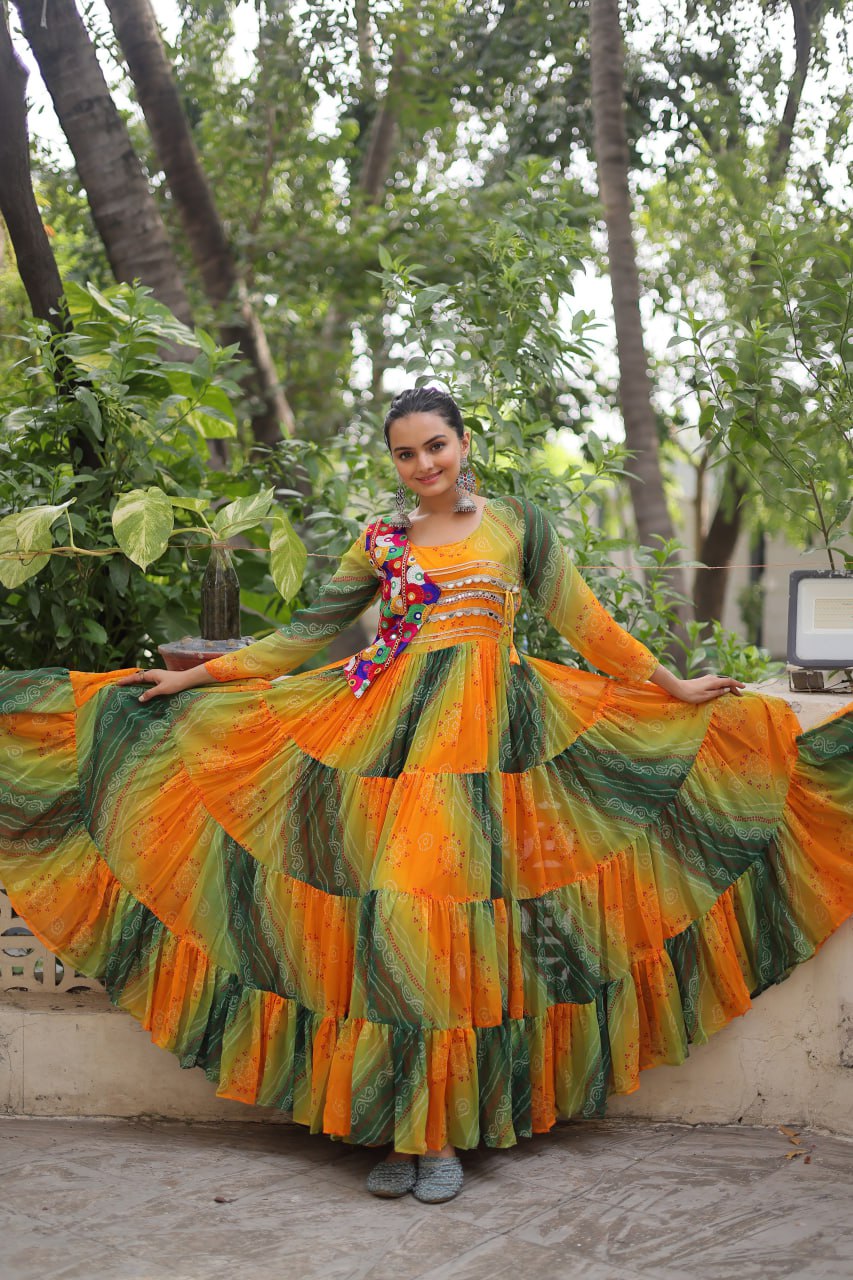 Mustard Faux Georgette Gown with Laheriya & Bandhej Print and Kutchi Patch Work – Elegant Ethnic Wear (User can adjust From 38" to 44" for your body comfort)