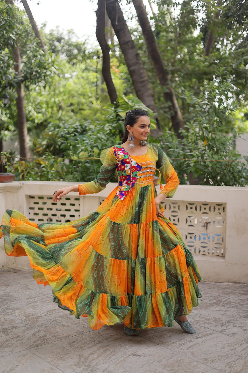 Mustard Faux Georgette Gown with Laheriya & Bandhej Print and Kutchi Patch Work – Elegant Ethnic Wear (User can adjust From 38" to 44" for your body comfort)