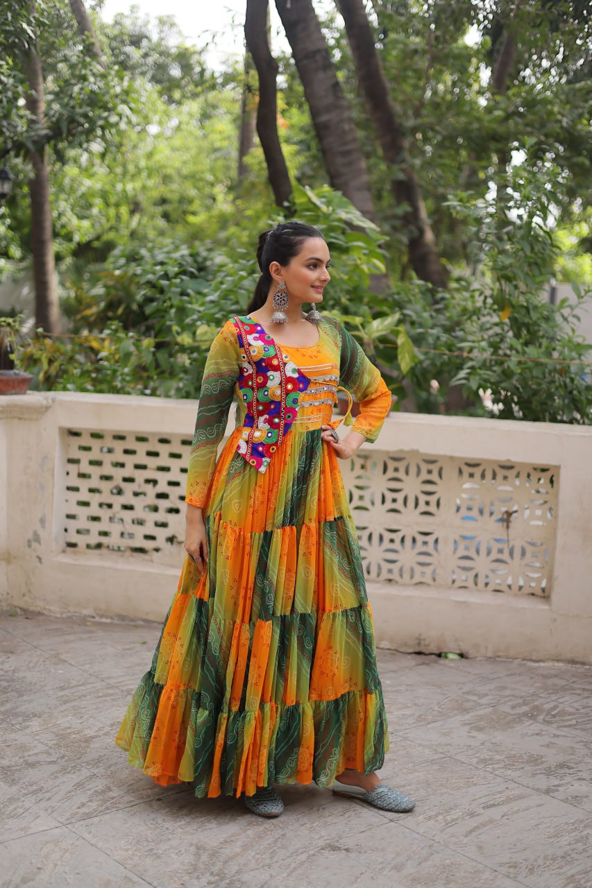 Mustard Faux Georgette Gown with Laheriya & Bandhej Print and Kutchi Patch Work – Elegant Ethnic Wear (User can adjust From 38" to 44" for your body comfort)