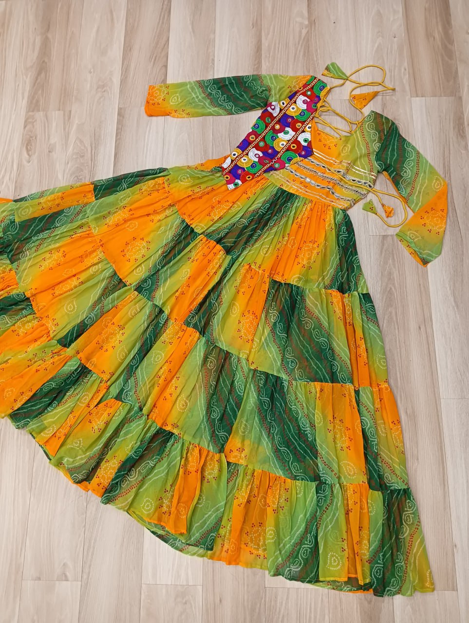 Mustard Faux Georgette Gown with Laheriya & Bandhej Print and Kutchi Patch Work – Elegant Ethnic Wear (User can adjust From 38" to 44" for your body comfort)