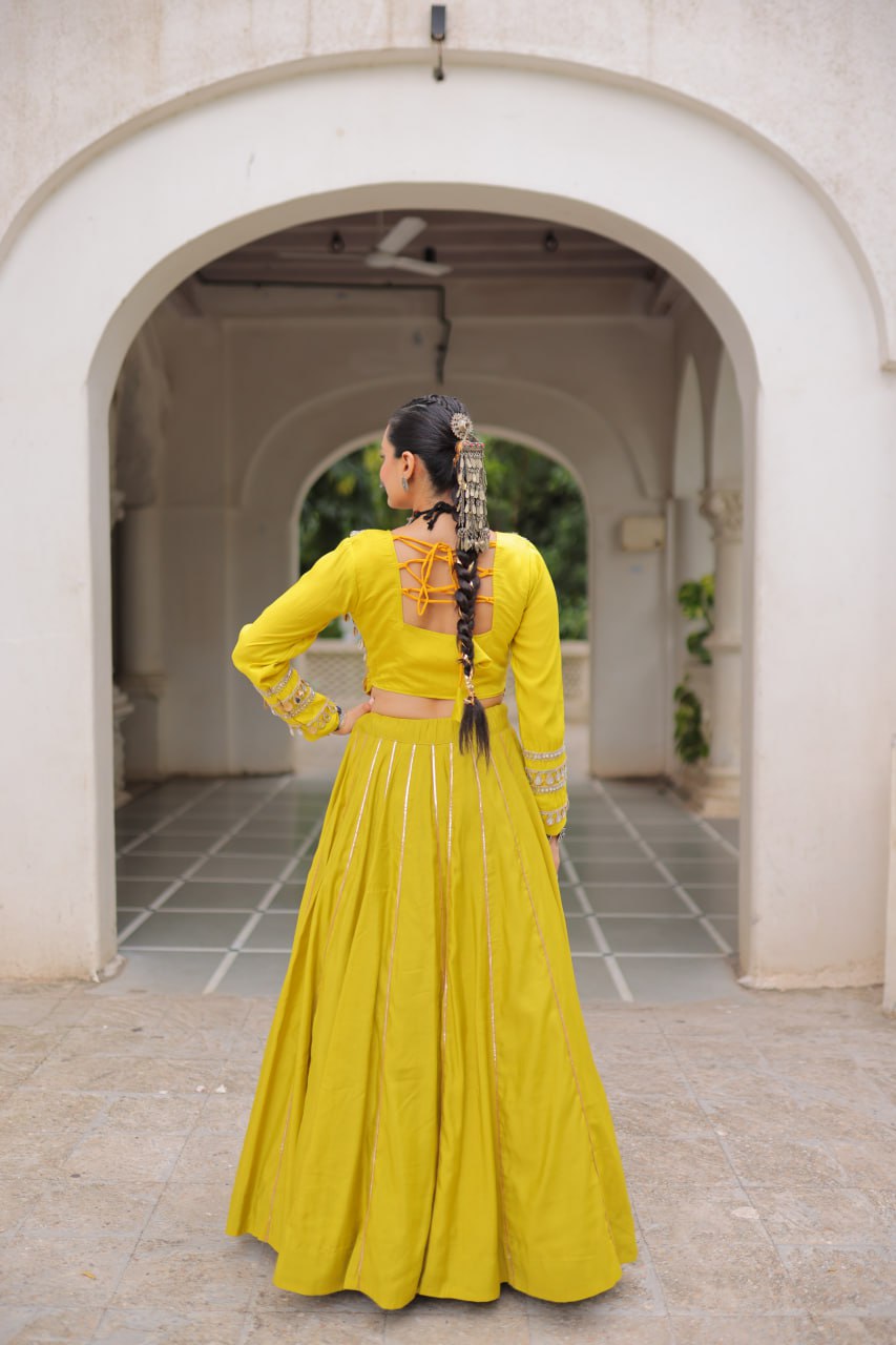 Designer Roman Fabric Yellow Lehenga Choli Set with Kutchi Gamthi Embroidery & Gota Patti Lace – Full-Stitched | Flair 6 Mtr
