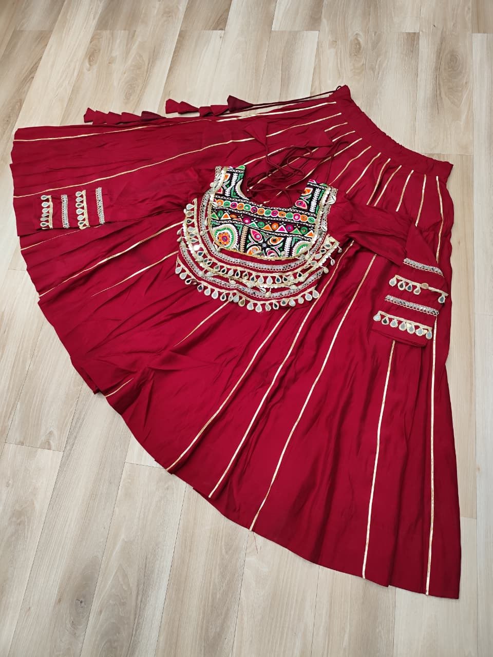 Designer Roman Fabric Maroon  Lehenga Choli Set with Kutchi Gamthi Embroidery & Gota Patti Lace – Full-Stitched | Flair 6 Mtr