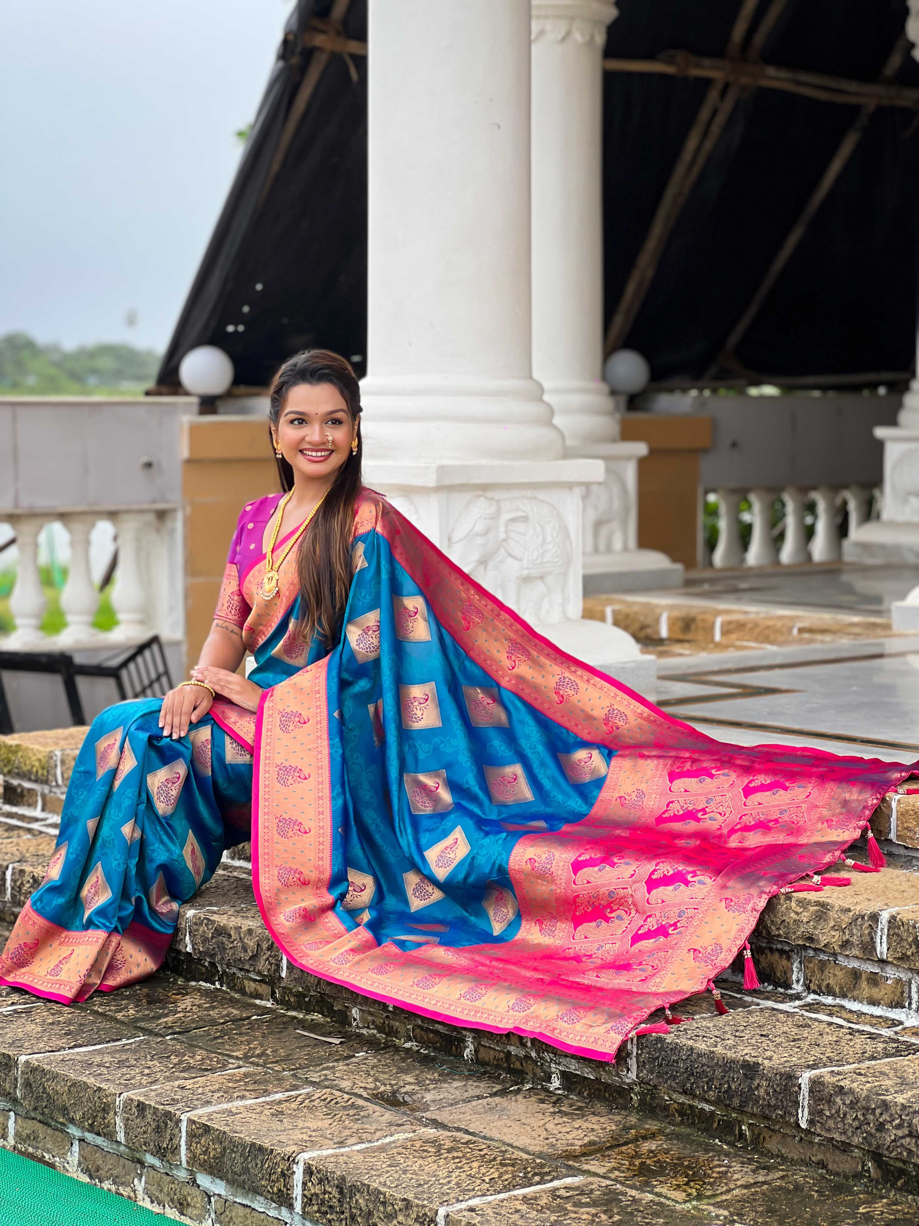 Firozi Soft Banarasi silk saree with zari weaving Meenakari design all over the saree & contrast weawing Rich pallu with contrast weawing border & tessels attached at Pallu End. Blouse :- Soft silk weawing blouse piece