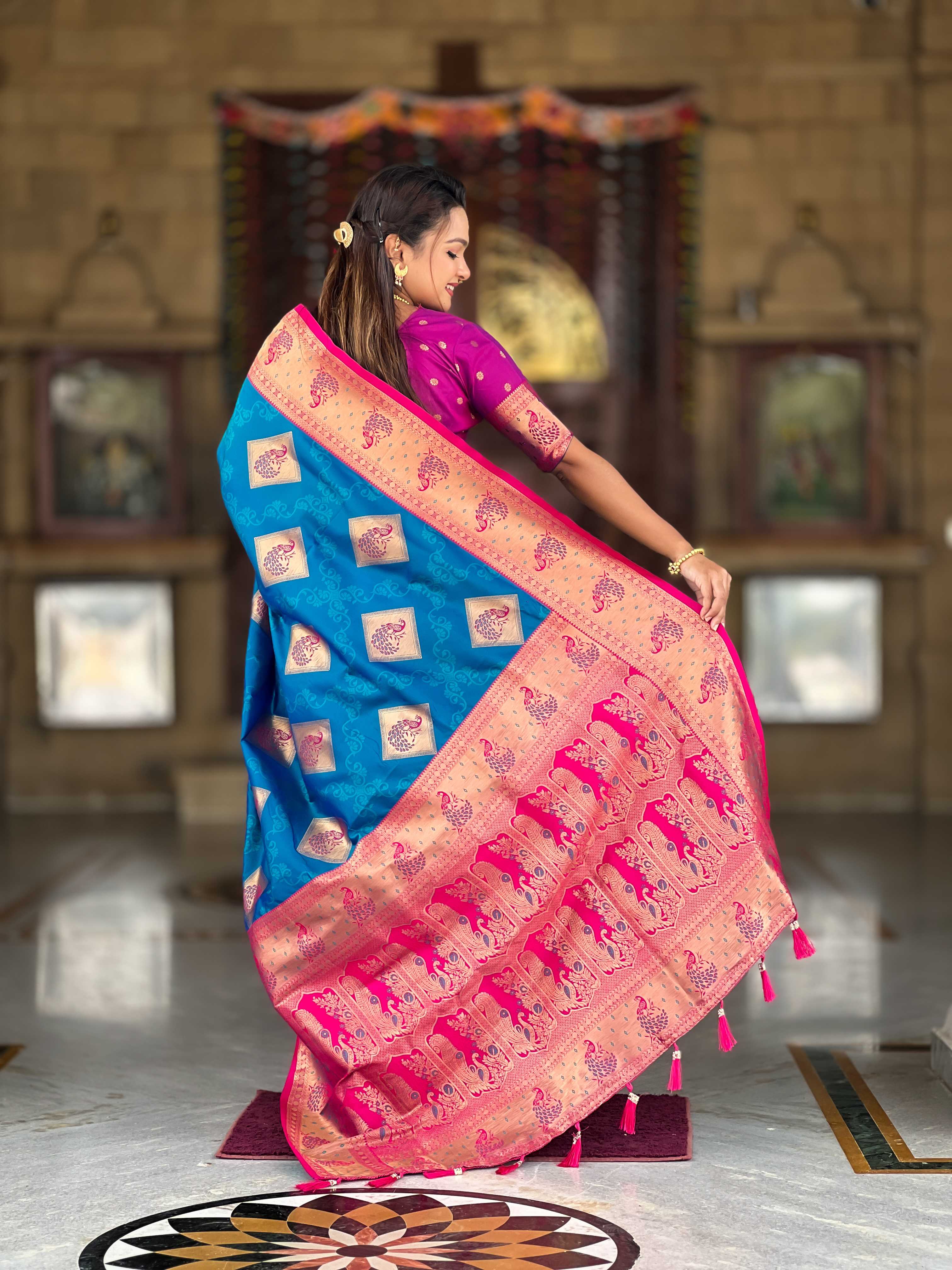 Firozi Soft Banarasi silk saree with zari weaving Meenakari design all over the saree & contrast weawing Rich pallu with contrast weawing border & tessels attached at Pallu End. Blouse :- Soft silk weawing blouse piece