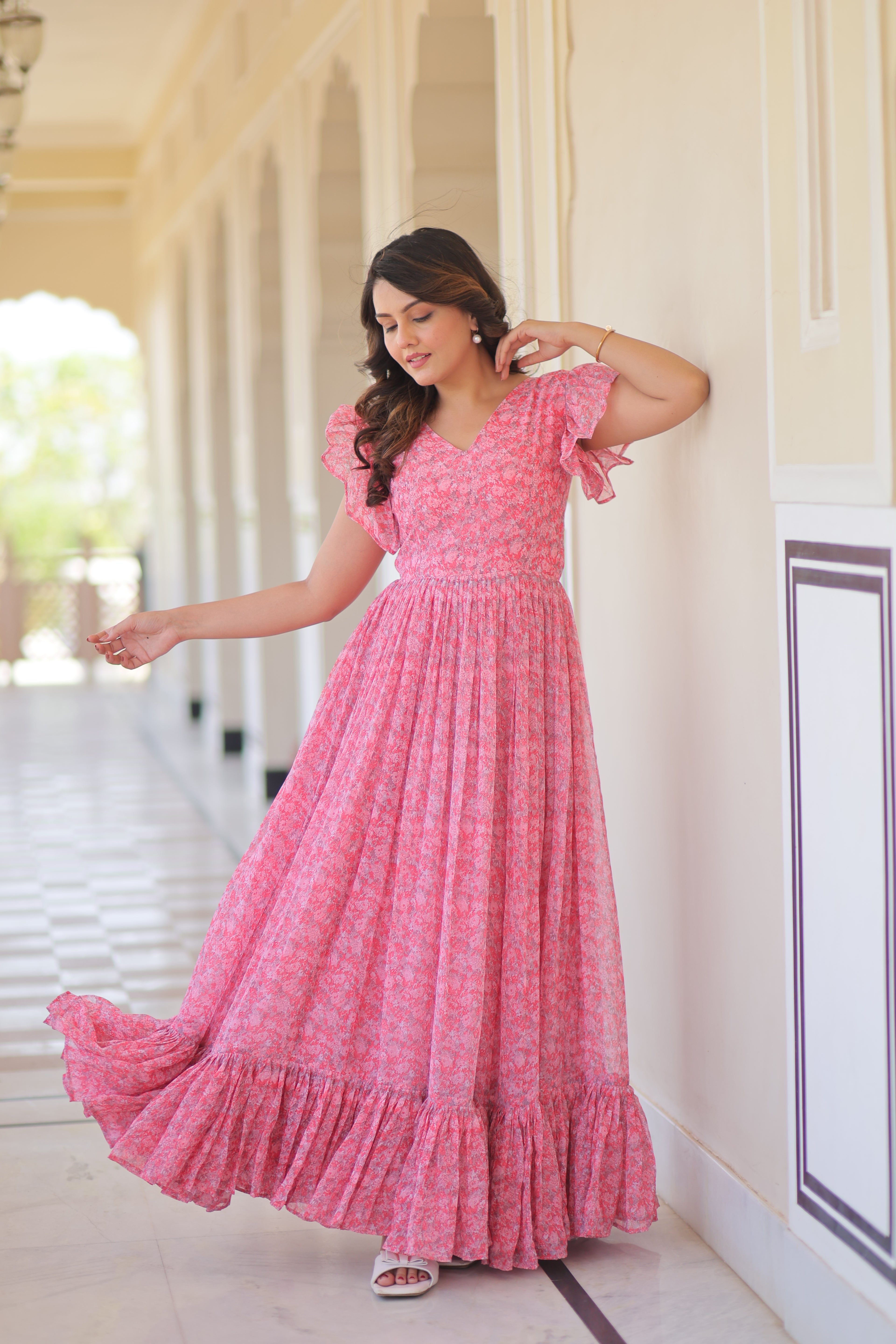 Faux Georgette Printed Pink Gown with Bell Sleeves | 7 Mtr Flair | Fancy V Neck | Full Stitched