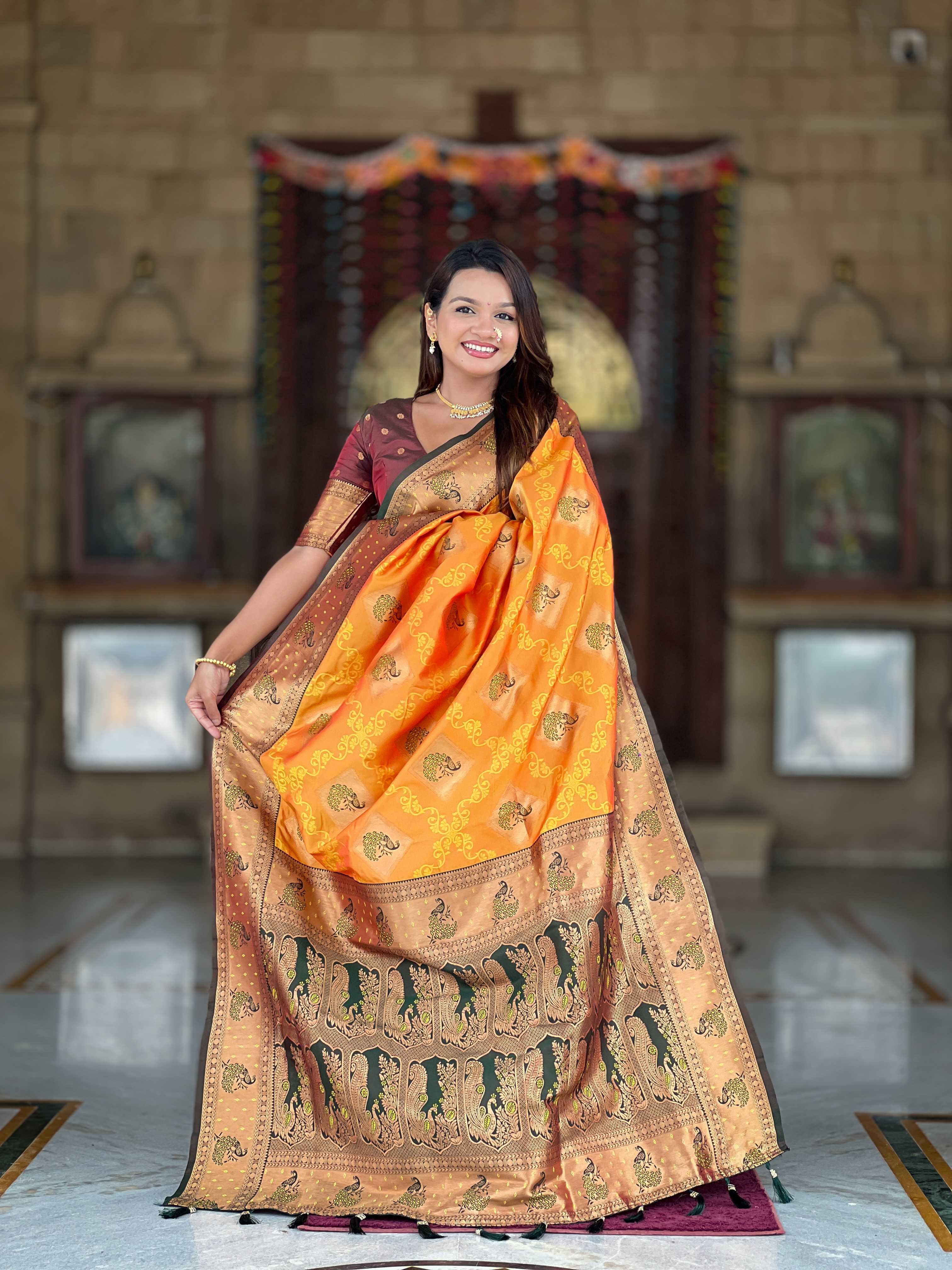 Orange Soft Banarasi silk saree with zari weaving Meenakari design all over the saree & contrast weawing Rich pallu with contrast weawing border & tessels attached at Pallu End. Blouse :- Soft silk weawing blouse piece