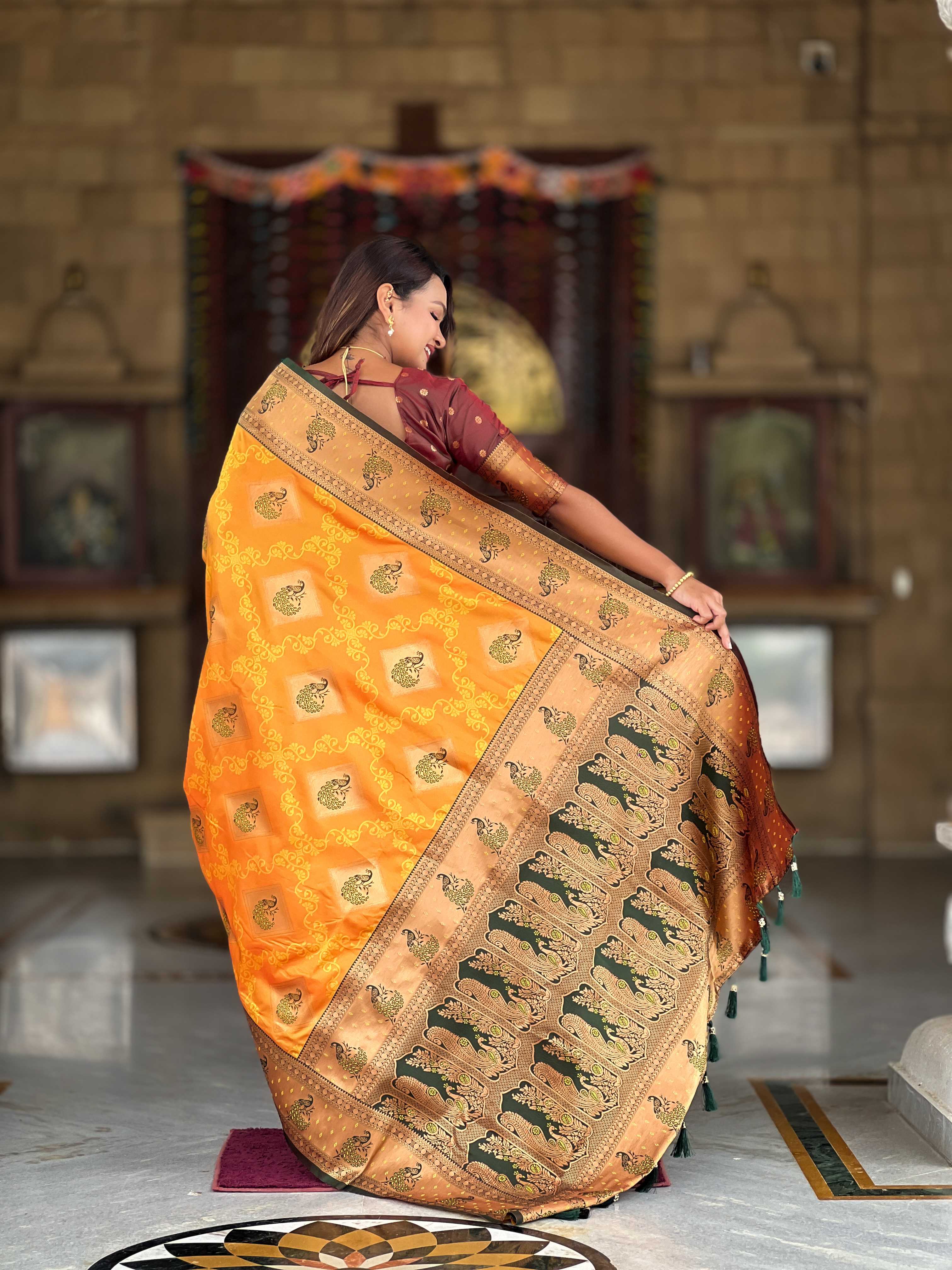 Orange Soft Banarasi silk saree with zari weaving Meenakari design all over the saree & contrast weawing Rich pallu with contrast weawing border & tessels attached at Pallu End. Blouse :- Soft silk weawing blouse piece