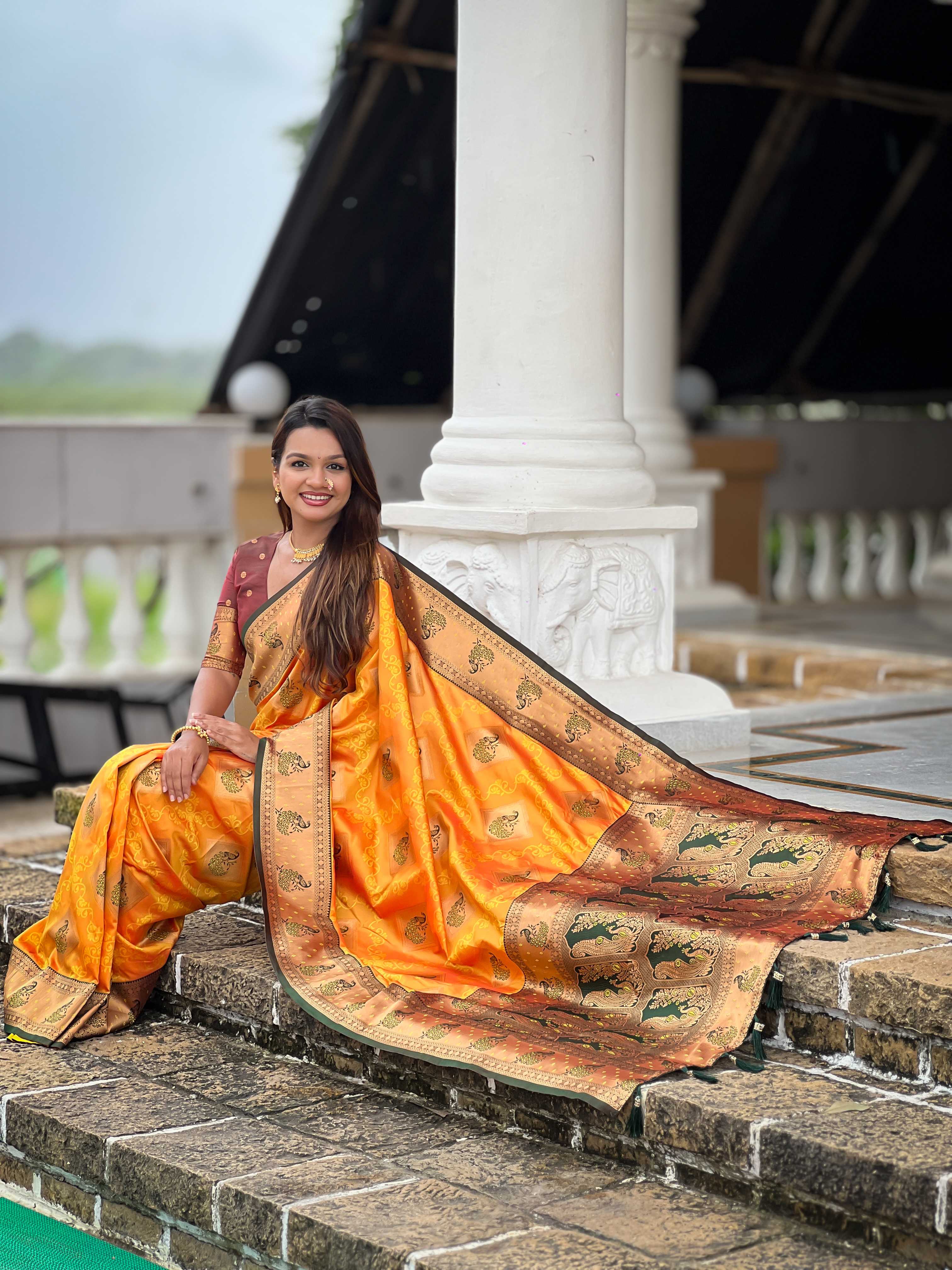 Orange Soft Banarasi silk saree with zari weaving Meenakari design all over the saree & contrast weawing Rich pallu with contrast weawing border & tessels attached at Pallu End. Blouse :- Soft silk weawing blouse piece