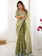 Light Green Georgette Saree with White Embroidery and Scalloped Borders
