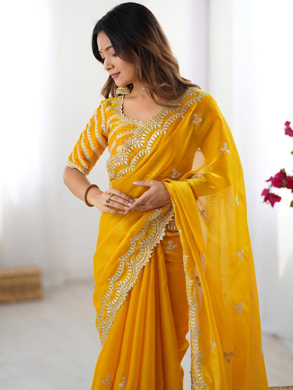 Yellow Georgette Saree with White Embroidery and Scalloped Borders