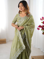 Light Green Georgette Saree with White Embroidery and Scalloped Borders