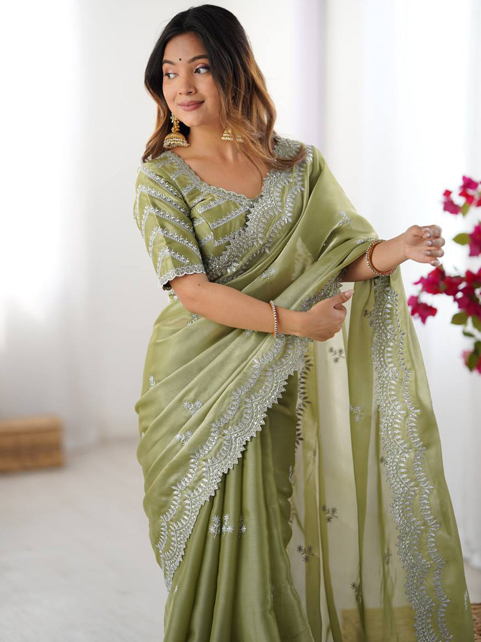 Light Green Georgette Saree with White Embroidery and Scalloped Borders
