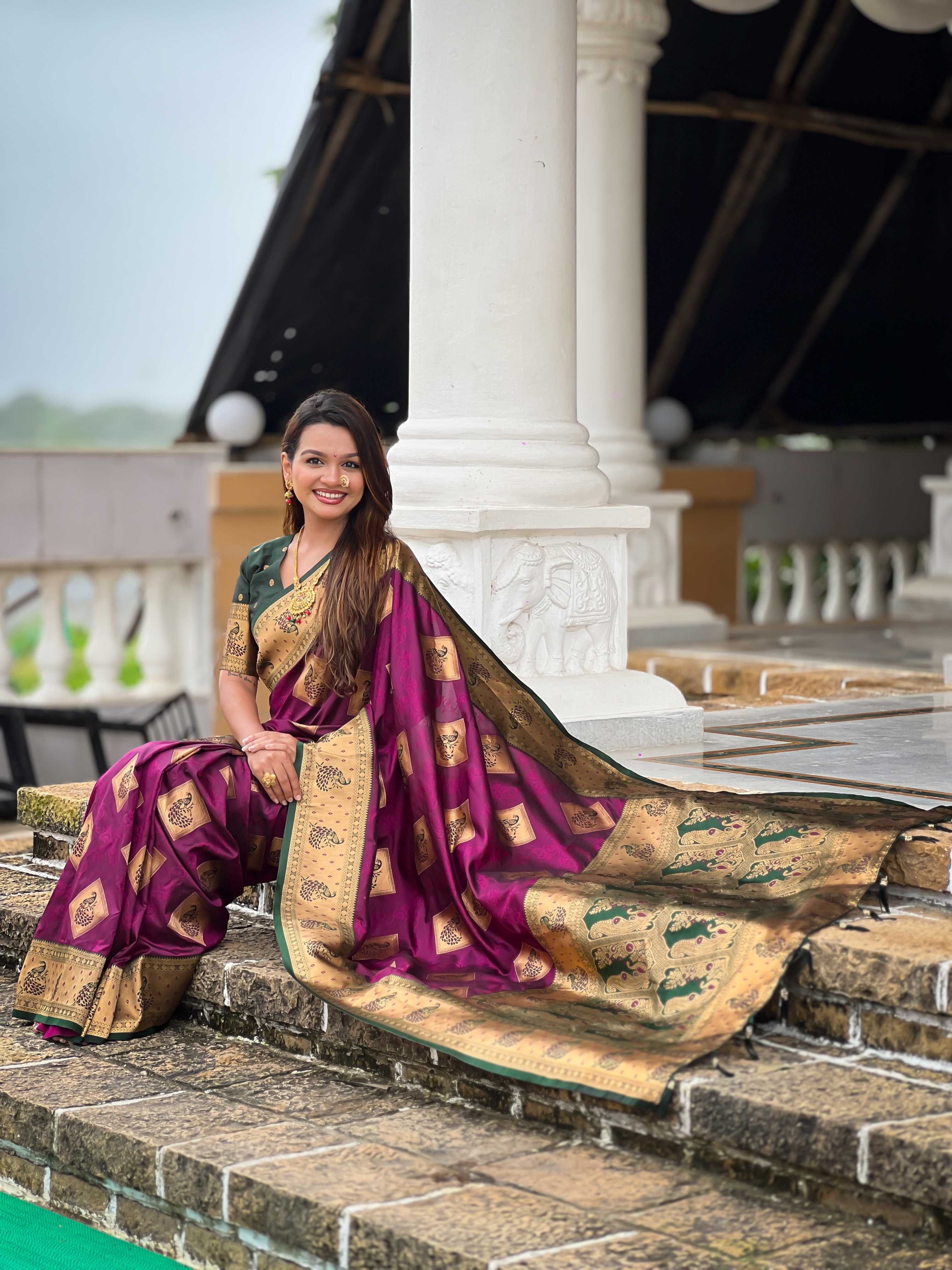 Wine Soft Banarasi silk saree with zari weaving Meenakari design all over the saree & contrast weawing Rich pallu with contrast weawing border & tessels attached at Pallu End. Blouse :- Soft silk weawing blouse piece