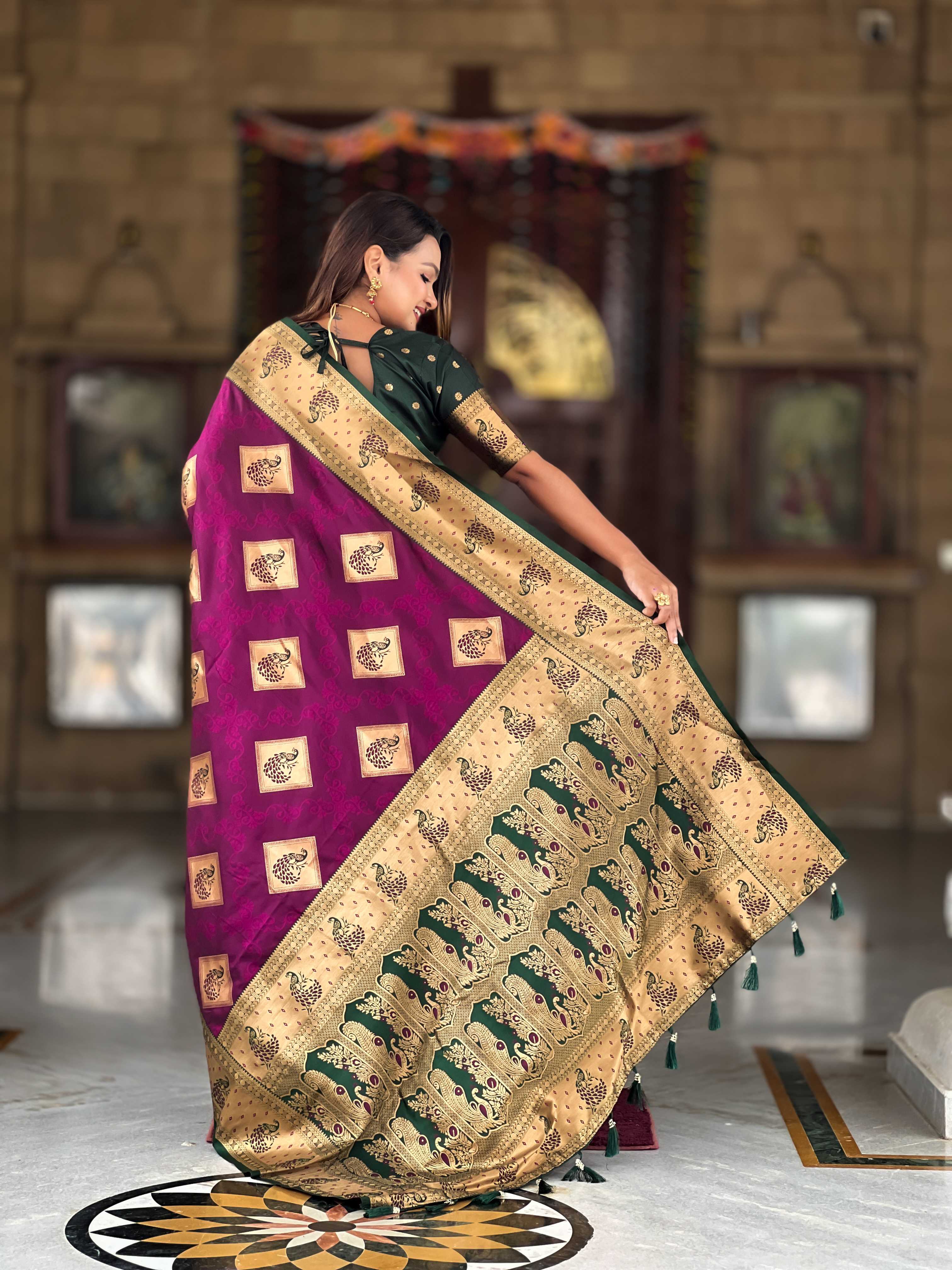 Wine Soft Banarasi silk saree with zari weaving Meenakari design all over the saree & contrast weawing Rich pallu with contrast weawing border & tessels attached at Pallu End. Blouse :- Soft silk weawing blouse piece