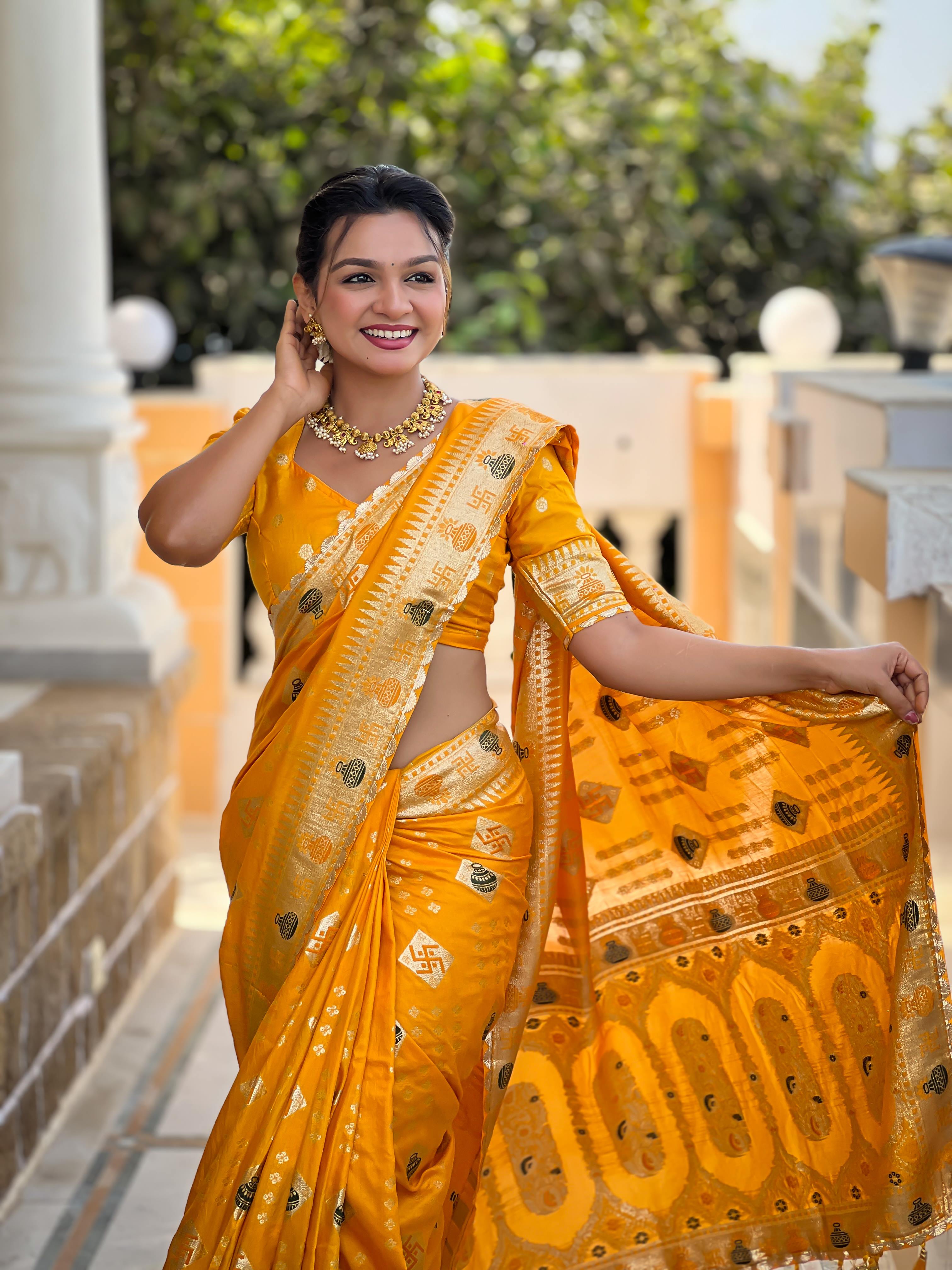 Yellow Varni Fabrics Women Floral Dolla Silk Tassels and Latkans Saree comes With Matching Blouse