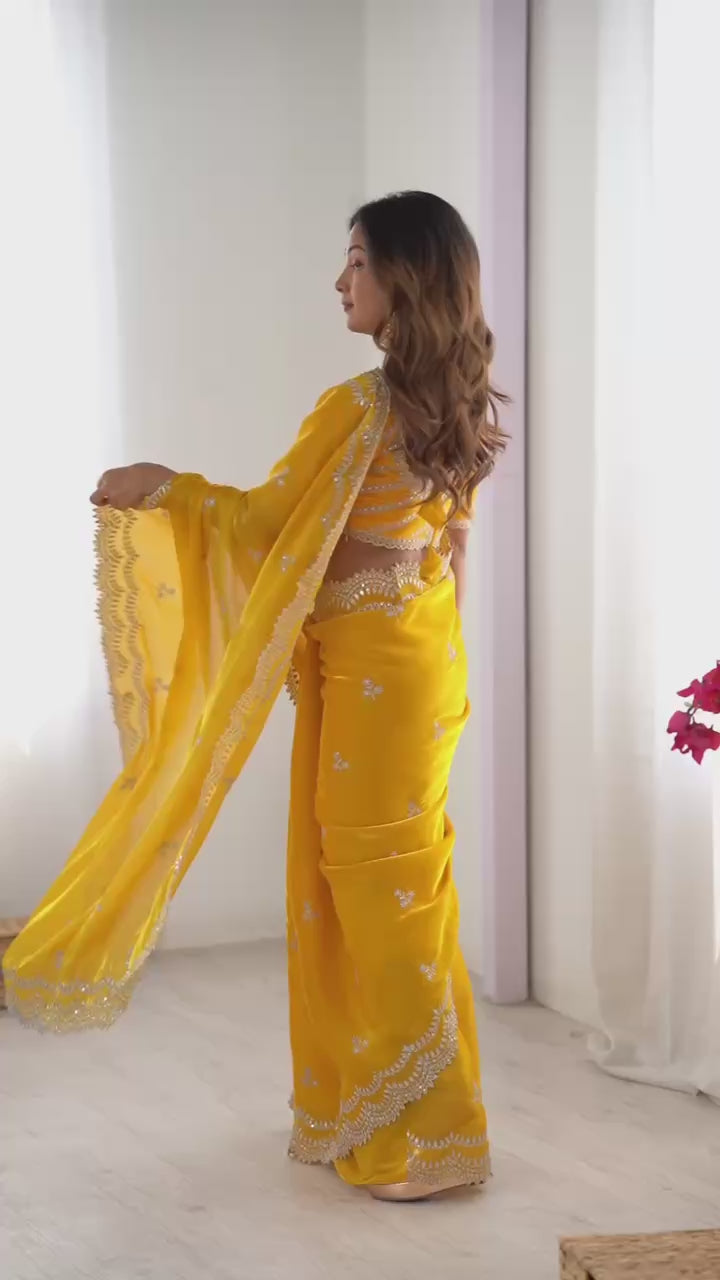 Yellow Georgette Saree with White Embroidery and Scalloped Borders