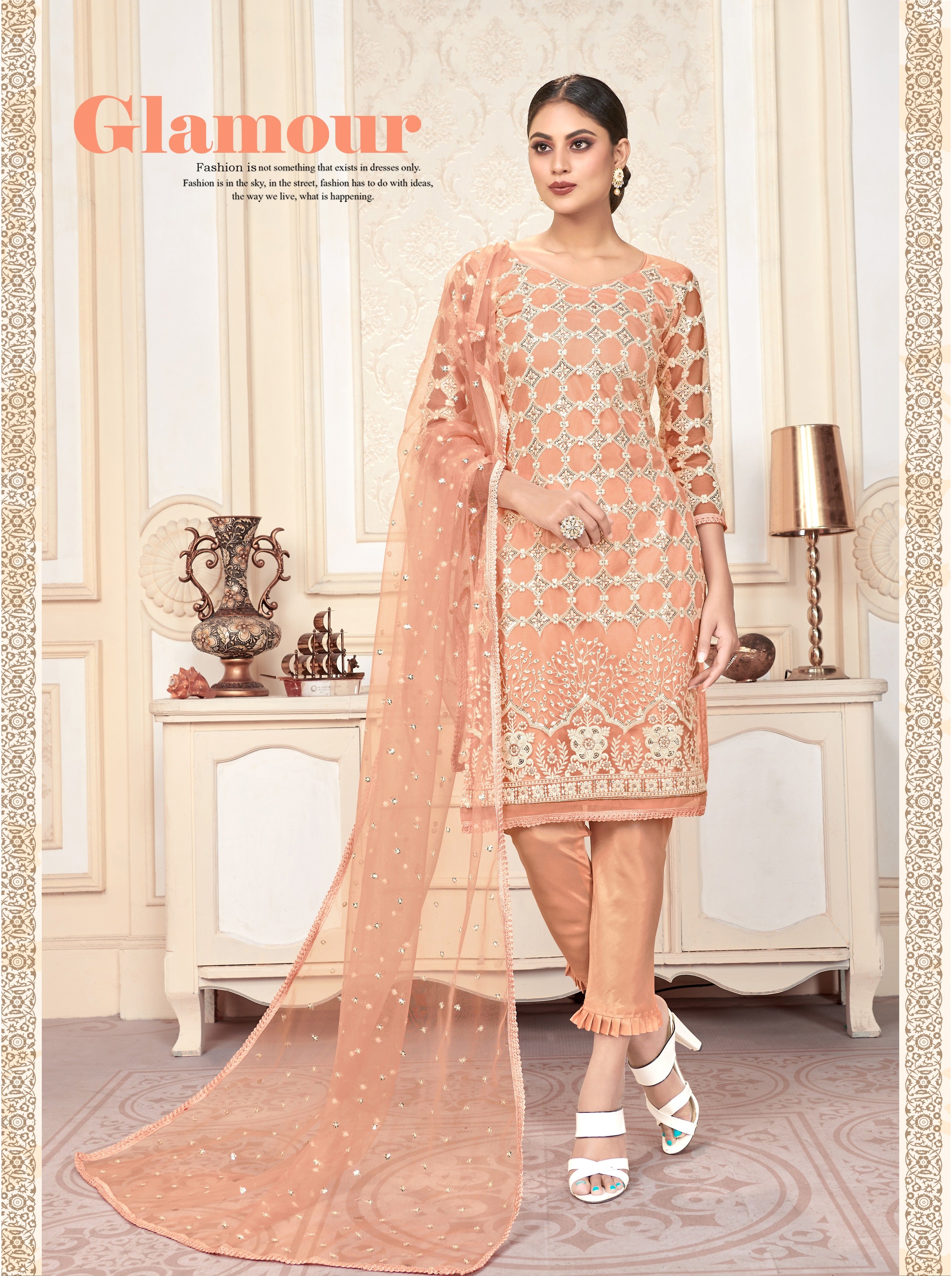 Peach Women Net Heavy Embroidery Work Semi Stitch Dress Material.